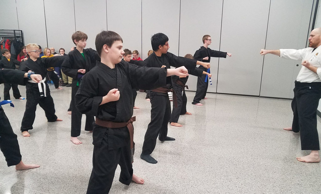 kids practice in karate class through Open Hand